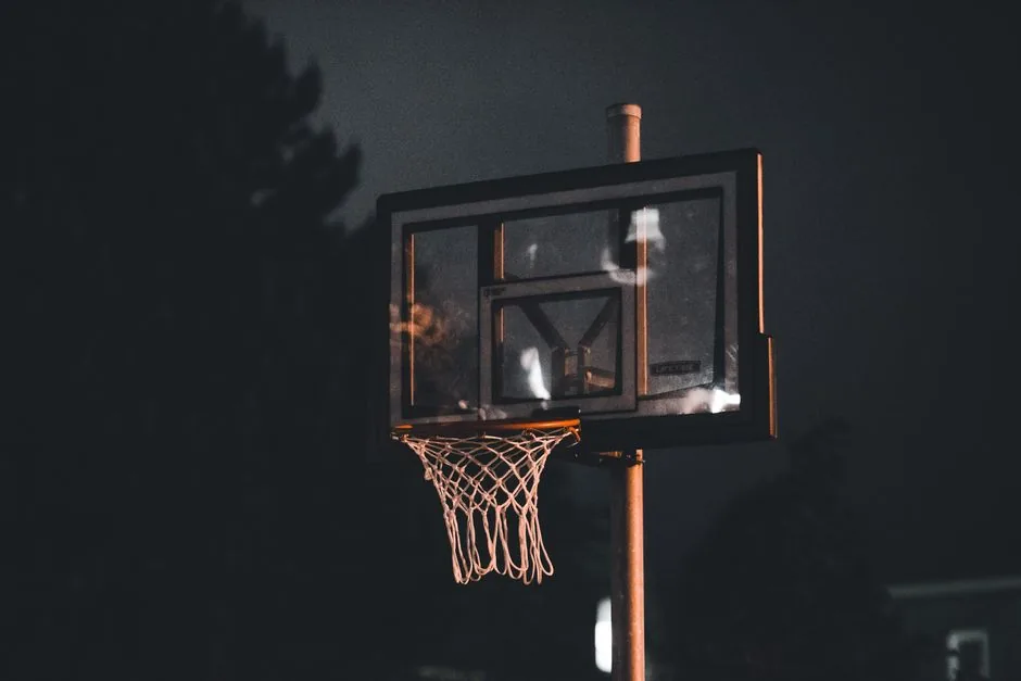 A basketball hoop lit up at night